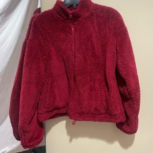 red fluffy zip up jacket